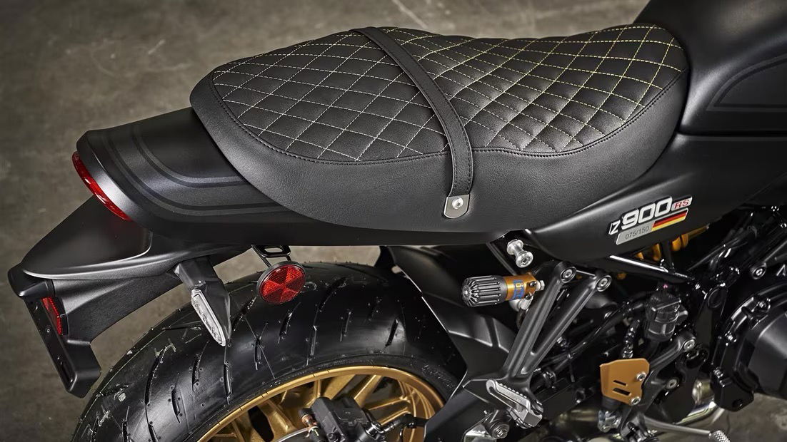 The seat is specially made for the bike and features gold stitching